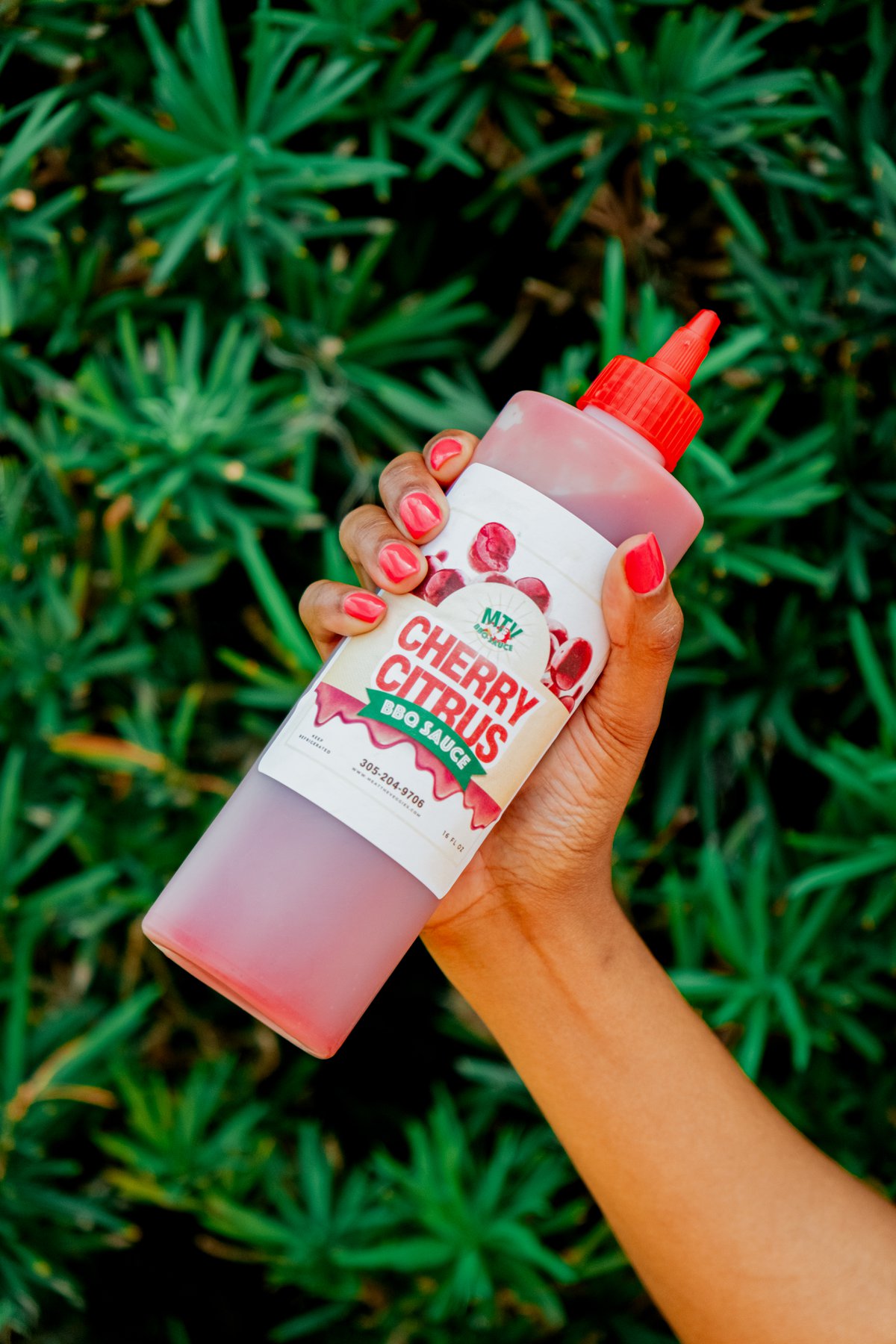 Product bottle held in hand for a lifestyle packaging shot