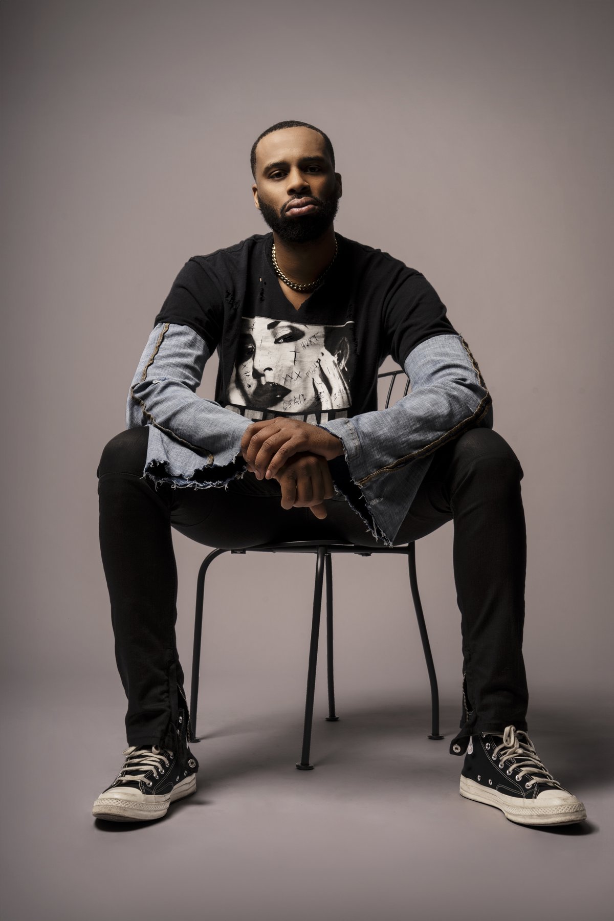 Seated editorial apparel portrait shot in studio