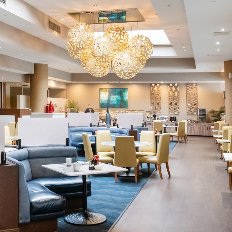 Hotel lobby lounge with sofas and pendant lights