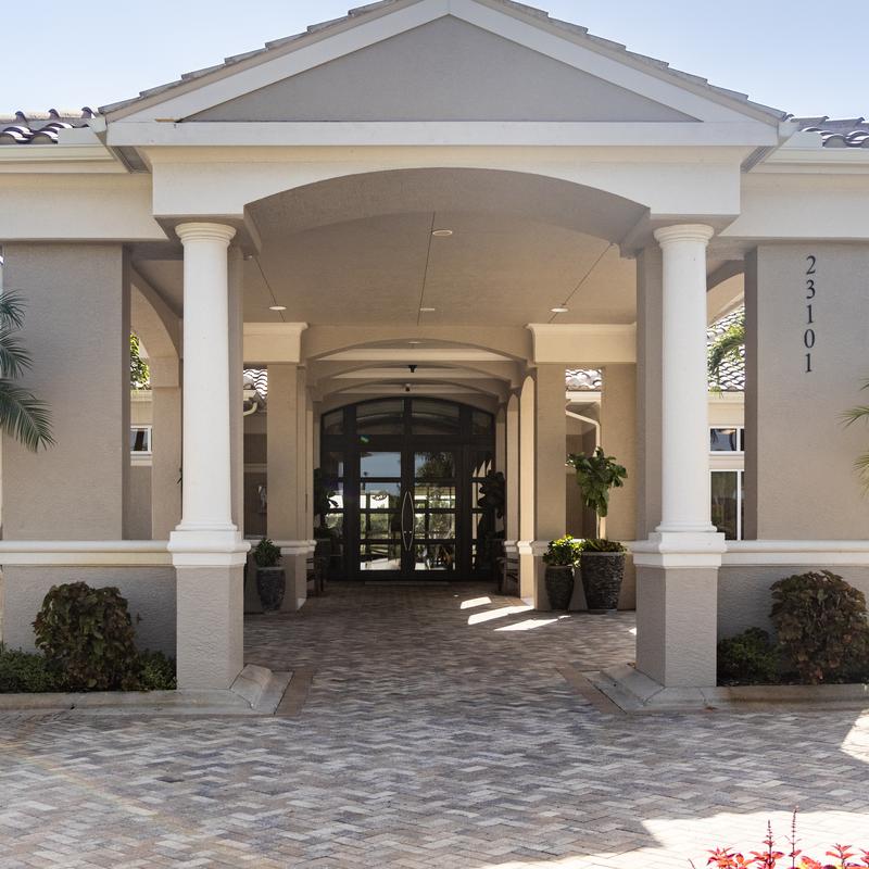 Columned entrance of a Spanish-style villa