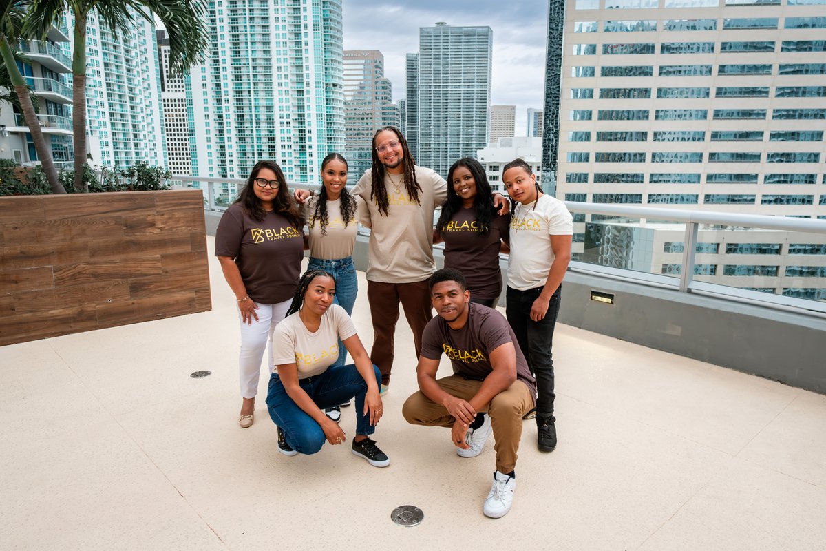 Team group portrait photographed on a rooftop terrace