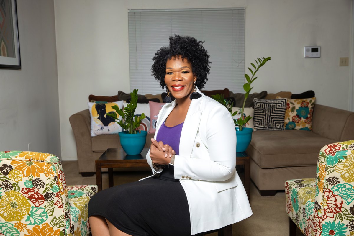 Seated brand portrait photographed in a styled interior